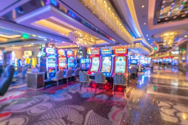 Jewels of Prosperity slot game interface showing gemstone symbols and spin button